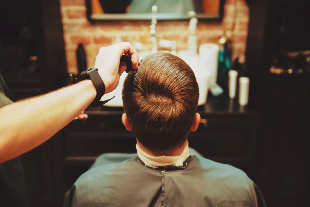Detail of a finished cut in the chair at Crowned Barber & Co.